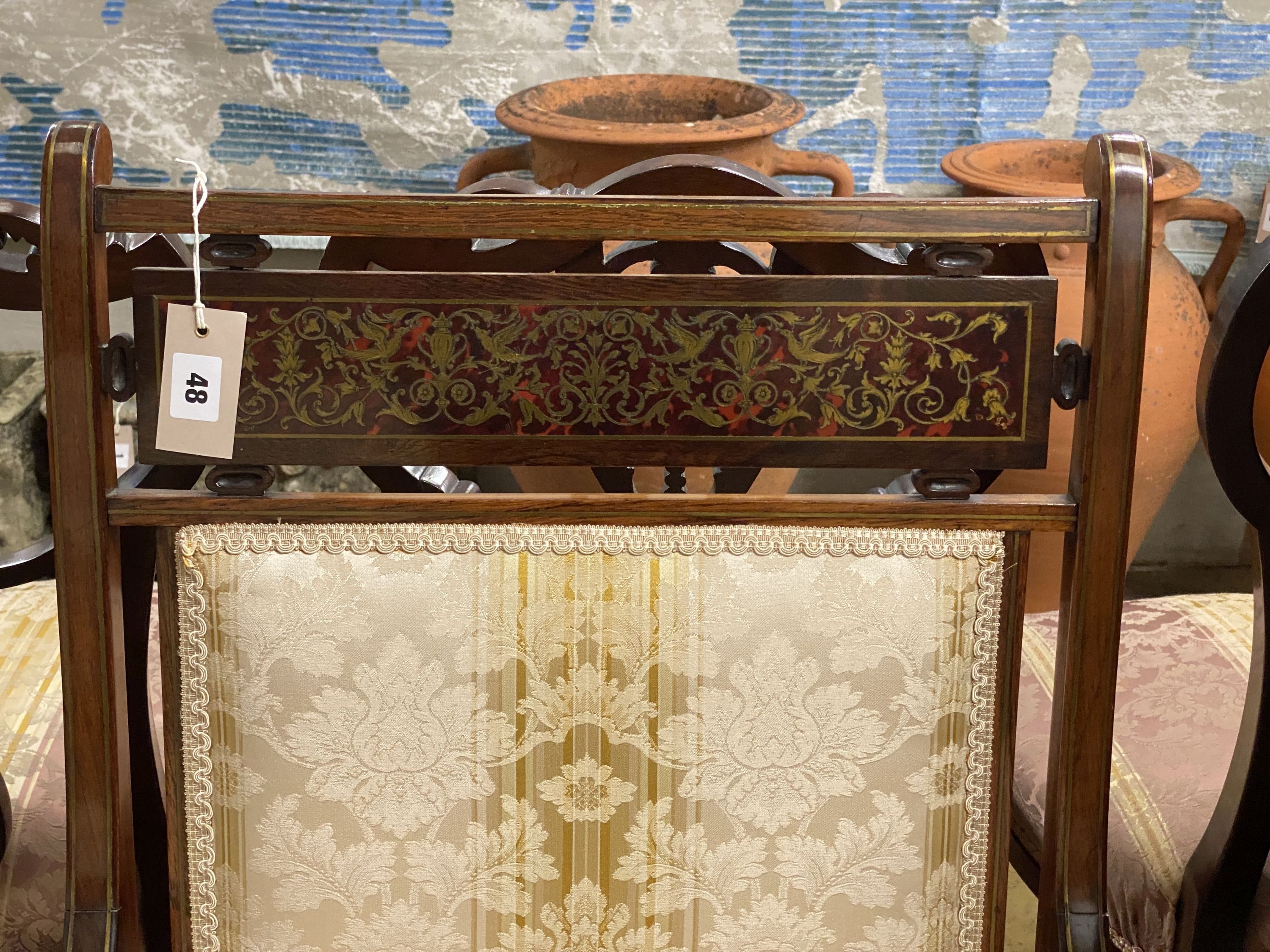 An Edwardian brass inlaid and boulle work rosewood upholstered armchair, width 60cm, depth 60cm, height 96cm